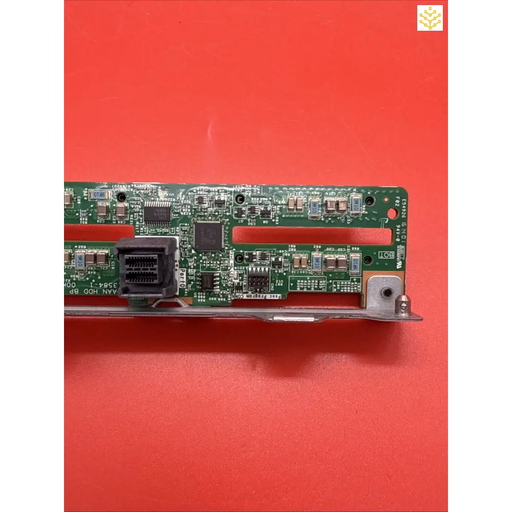 Circuit board with electronic components and connectors mounted on a metal bracket.