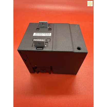 Black electronic control module with terminal connections and mounting hardware.