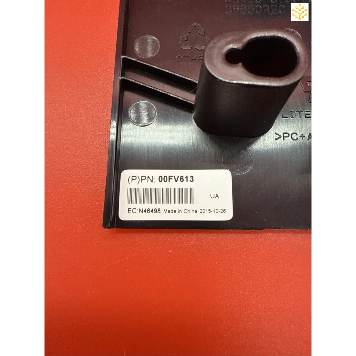 Black cylindrical socket or tool component with a barcode label attached.