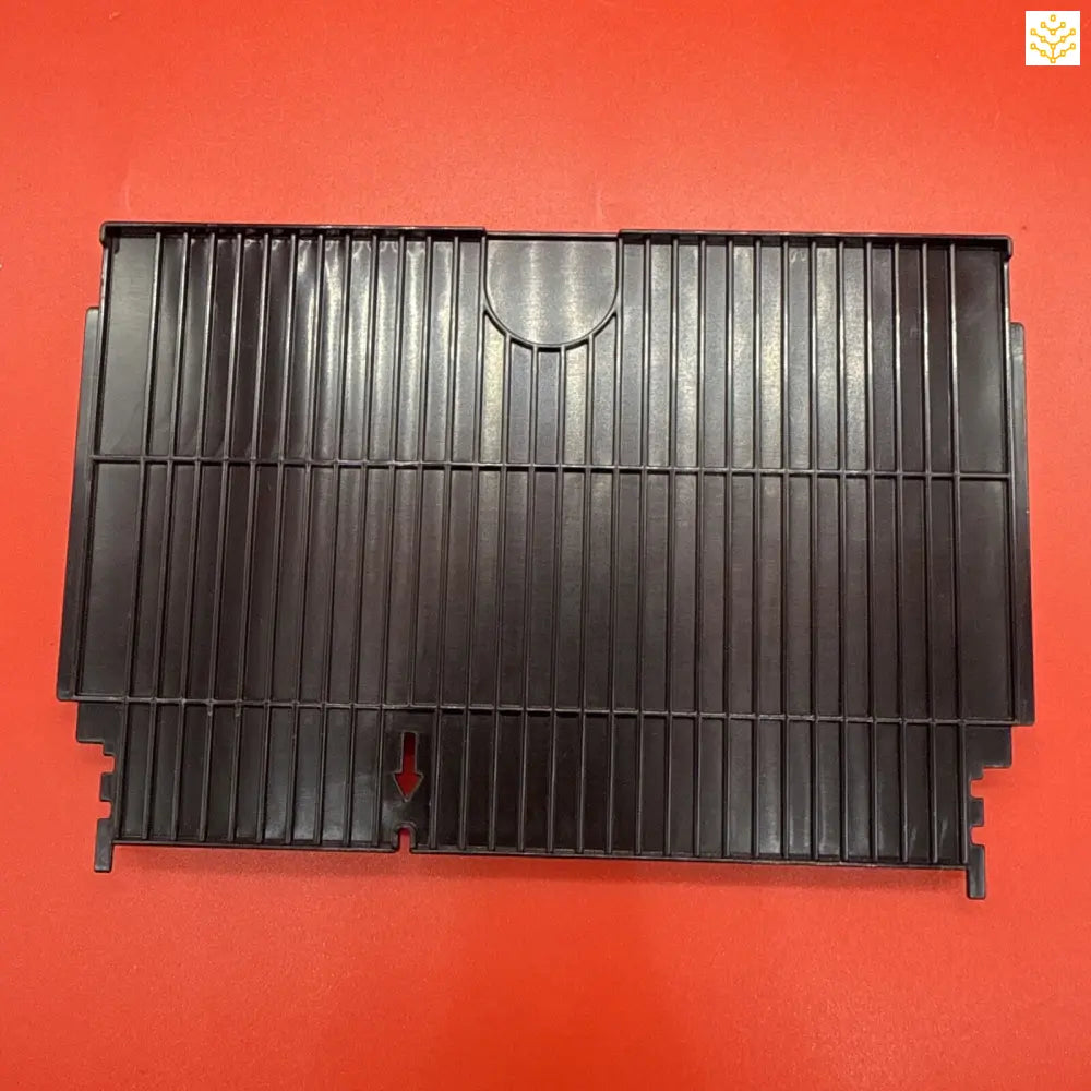 Black plastic radiator cover with vertical slats.