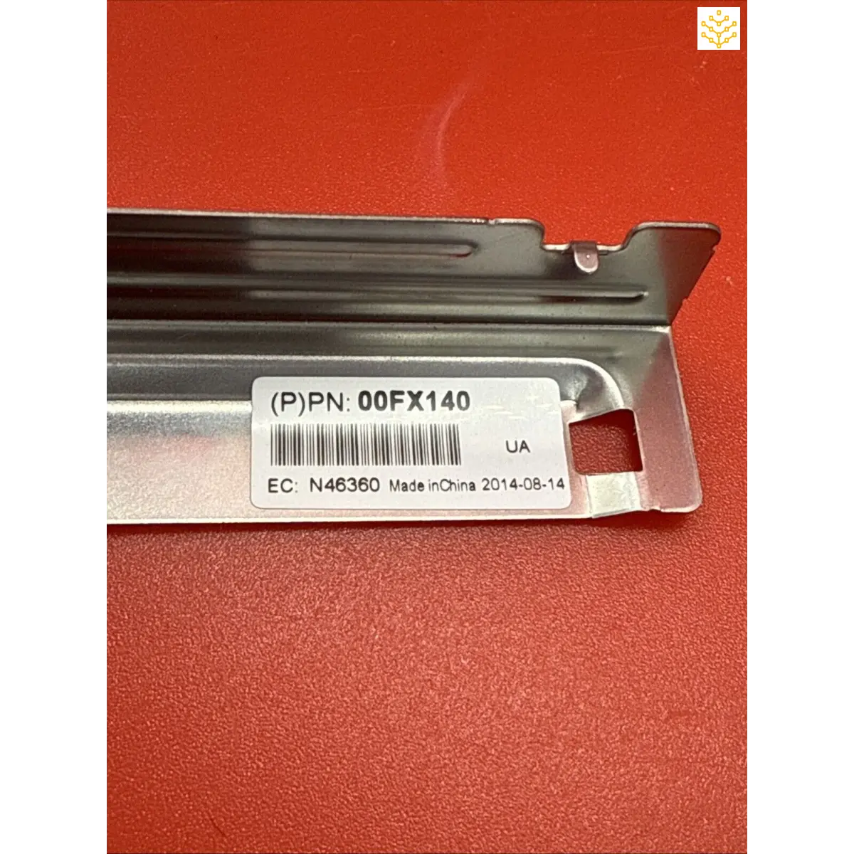 Metal bracket or mounting rail with a product label containing part number 00FX140.