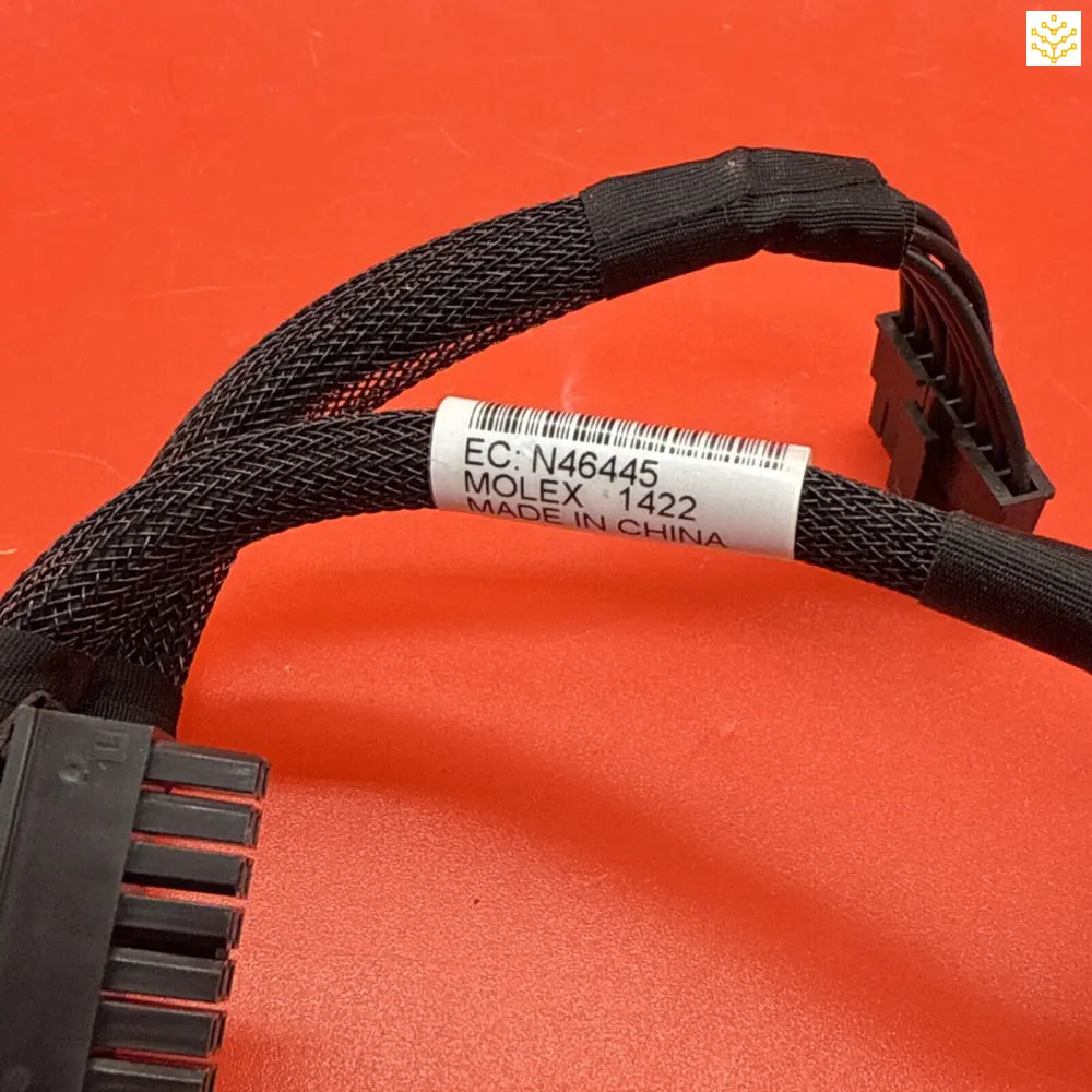 Black mesh cable sleeve or wire harness with a barcode label.