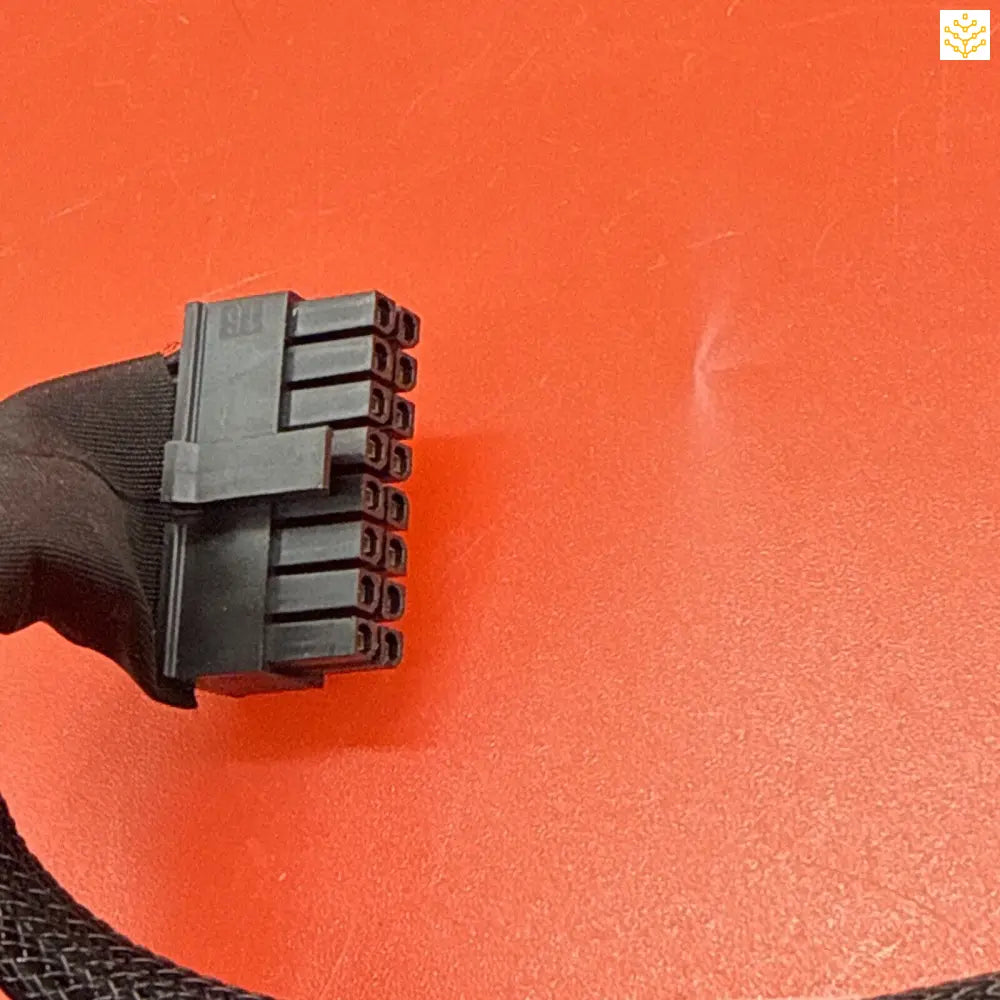 Black electrical connector with multiple pin terminals.