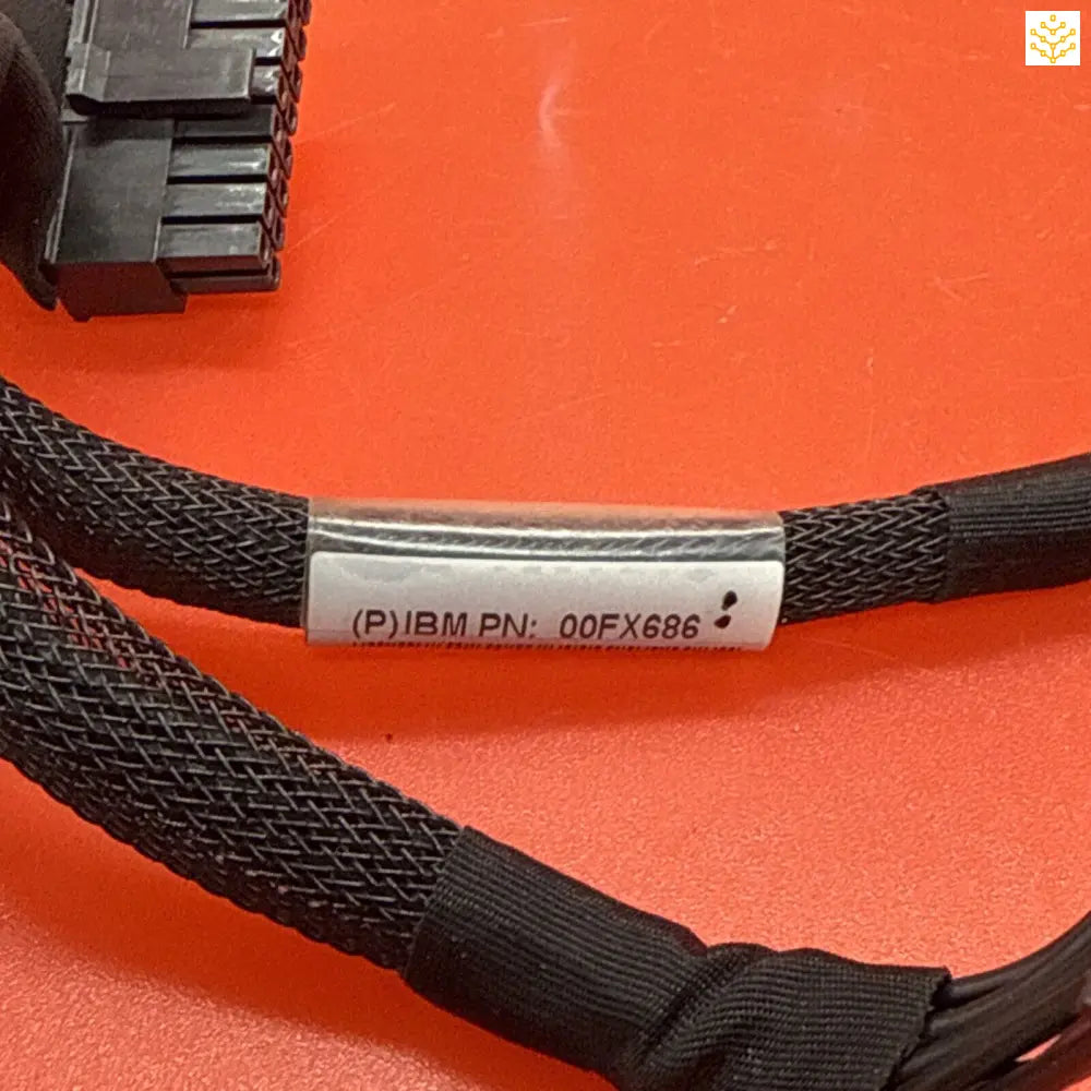 Black braided cable with a metal identification tag.