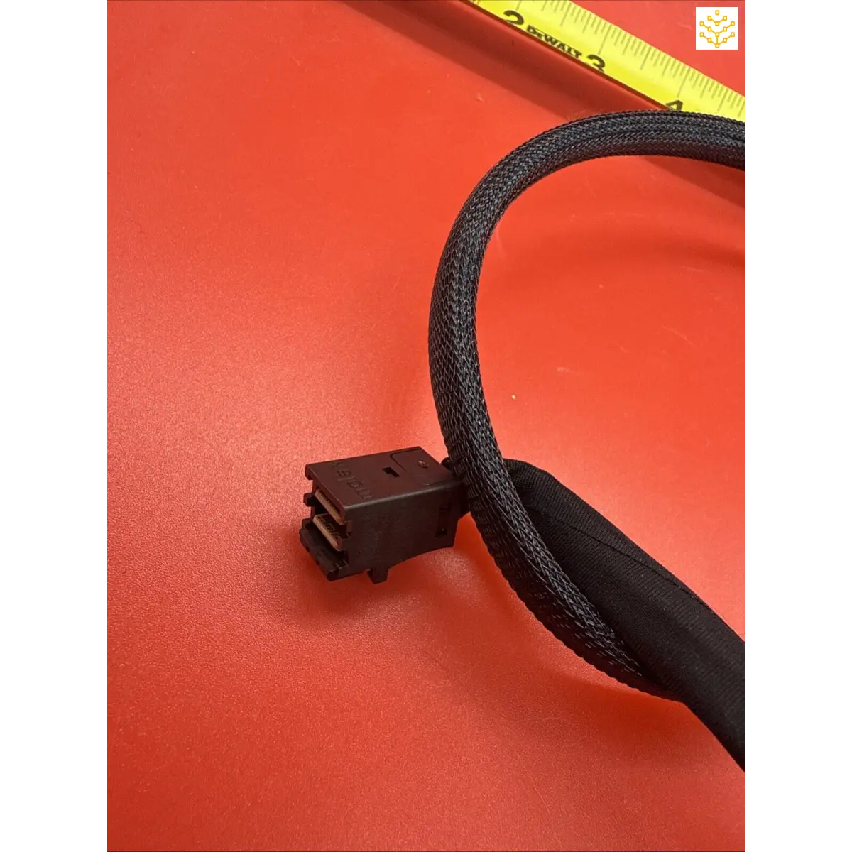 Black braided computer power cable with a connector end.