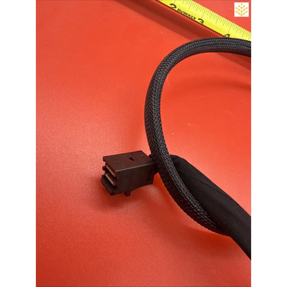 Black braided computer power cable with a connector end.