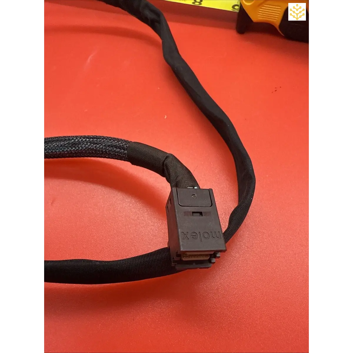 Black fabric-wrapped cable with a plastic connector.