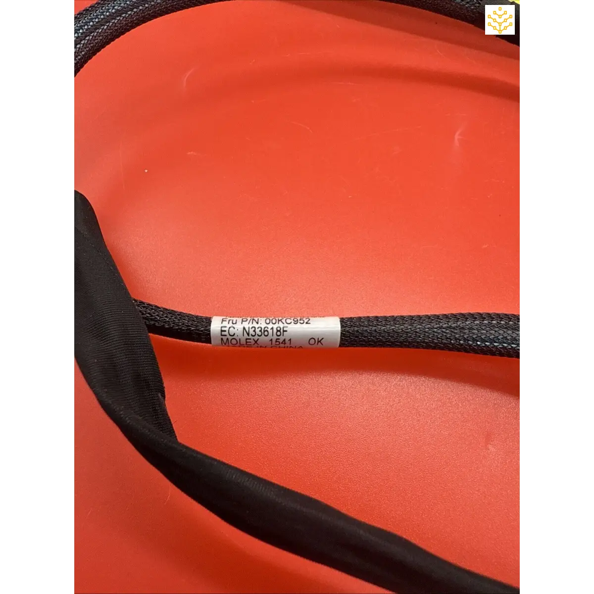 Black textile strap or cord with a printed label tag.