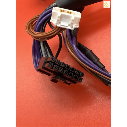 Electrical wiring harness with colored cables and plastic connectors.