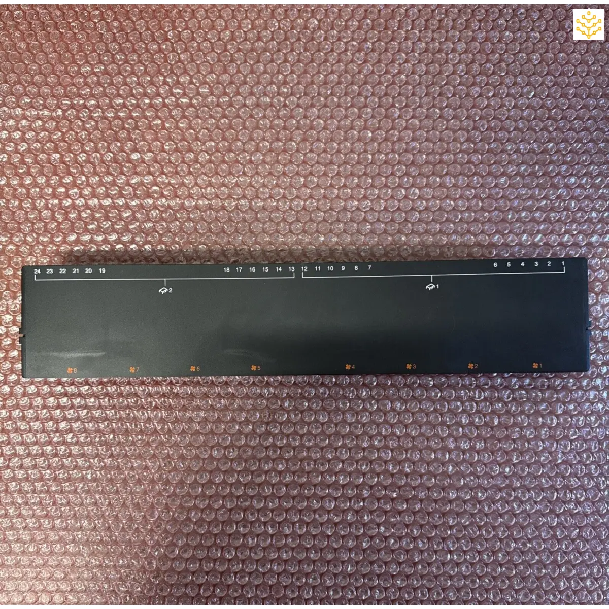 Black plastic ruler with measurement markings.