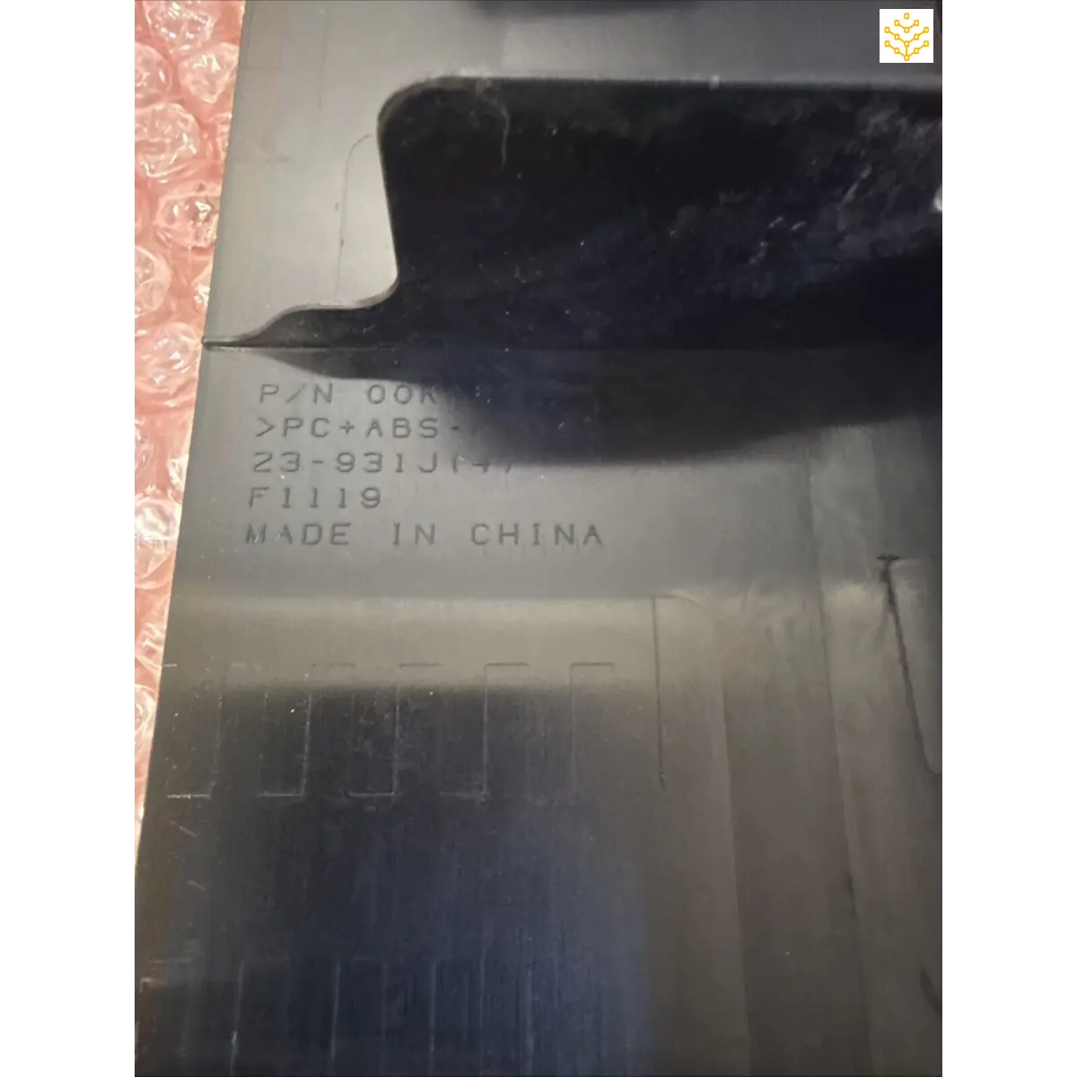 Molded plastic part with manufacturing text stamped ’MADE IN CHINA’ and other product codes.