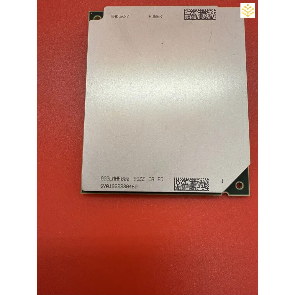 Square metallic processor or computing component with printed text and QR code.