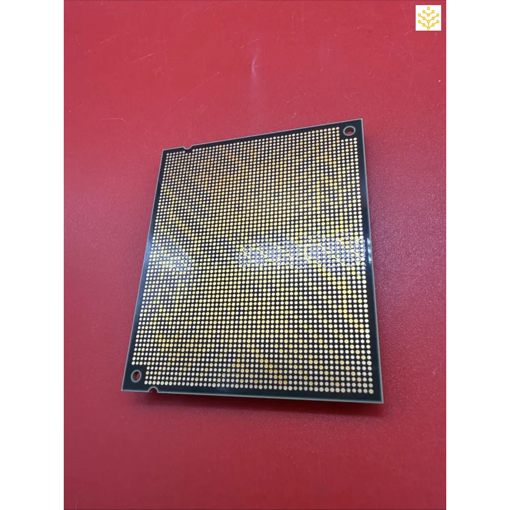 Computer processor chip with a grid pattern of contact points.