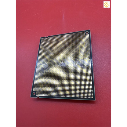 Computer processor chip with a grid pattern of contact points.