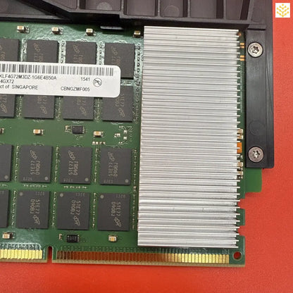 Computer memory module with an attached metal heatsink.