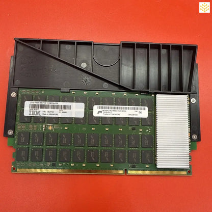 Computer RAM module with a black plastic heat spreader attached.