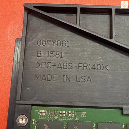 Plastic component with molded text showing part numbers and ’MADE IN USA’ marking.