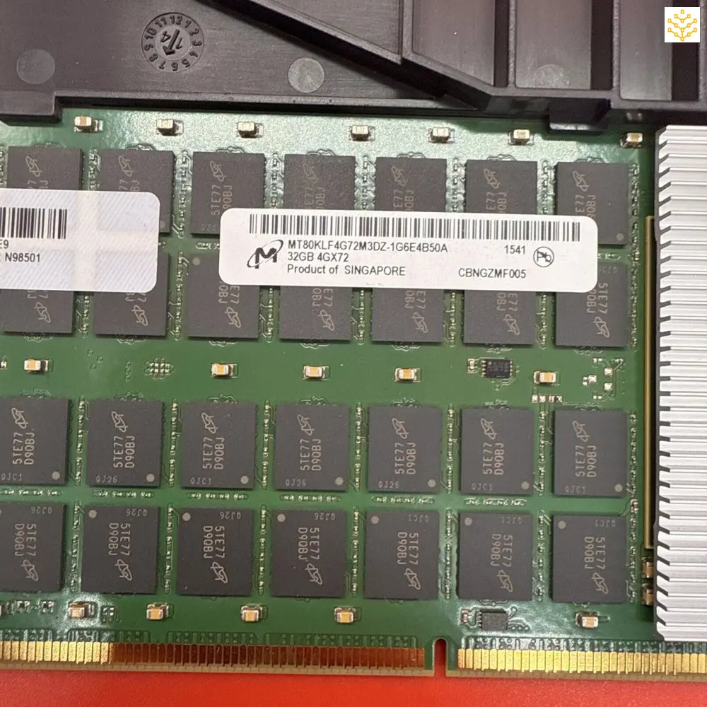 Computer RAM memory module with visible memory chips on a green circuit board.