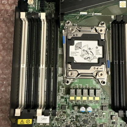 Computer motherboard with RAM slots and CPU socket.