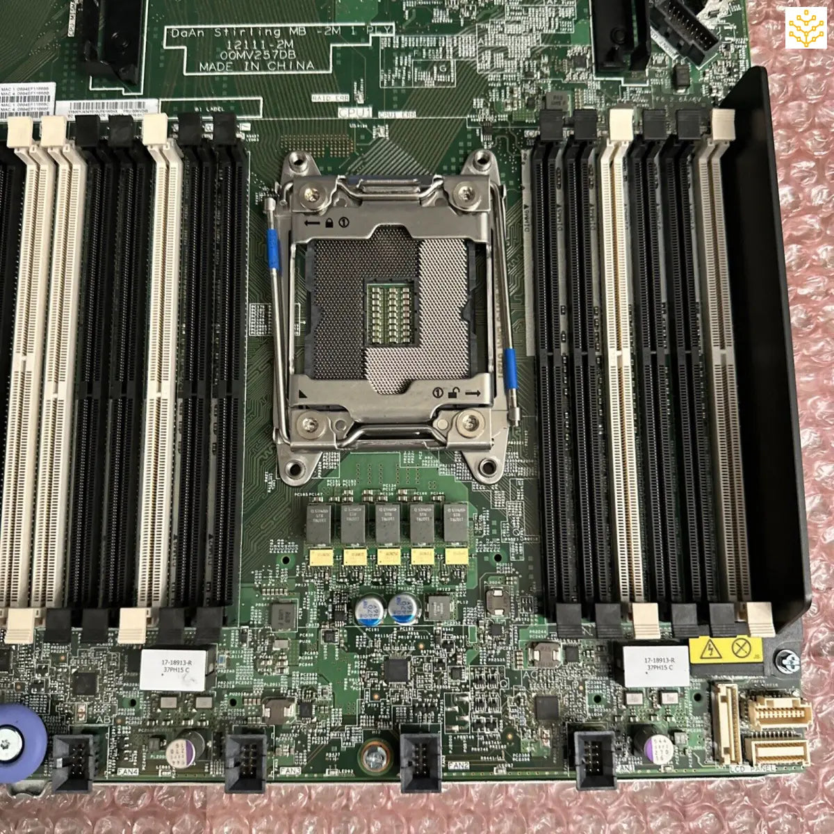 Computer motherboard with CPU socket and RAM slots.