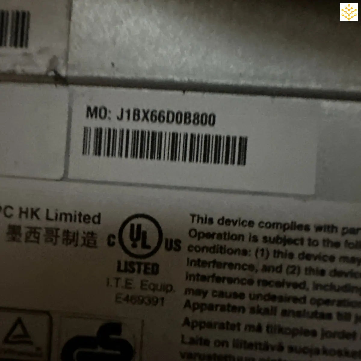 Barcode label with product code J1BX66D0B800 on what appears to be electronic equipment.