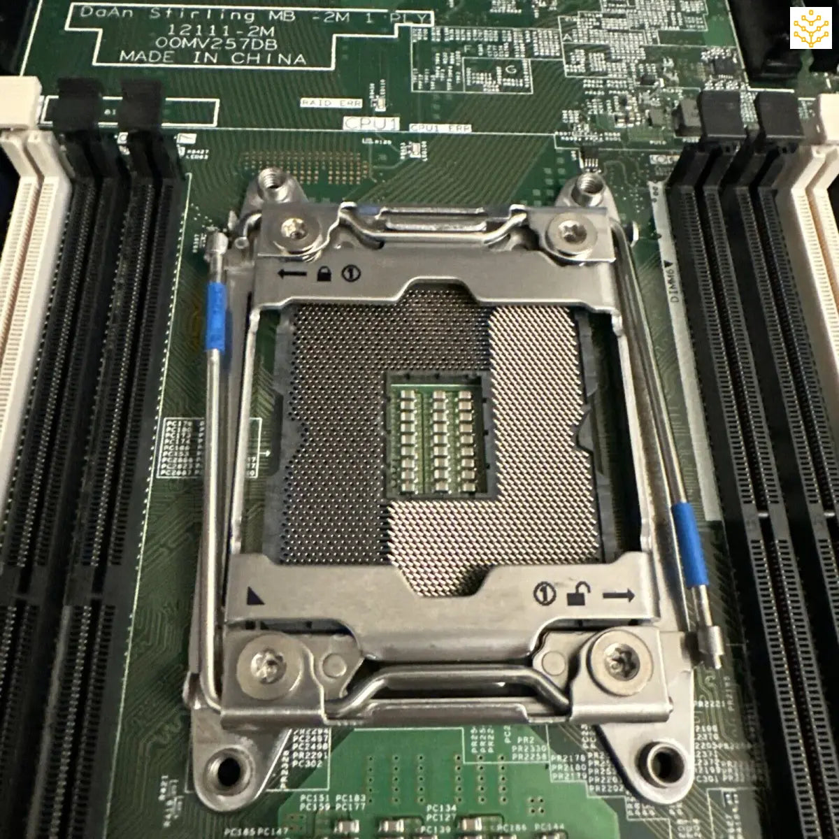 CPU socket on a motherboard with mounting brackets and pins visible.