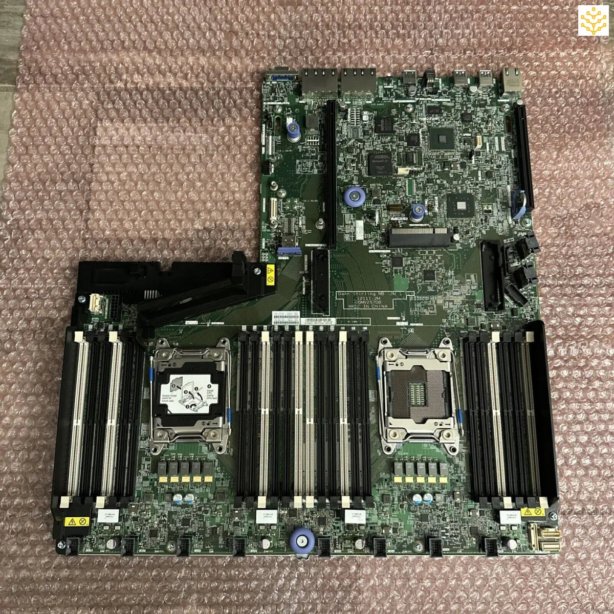 Server motherboard with dual CPU sockets and multiple RAM slots.