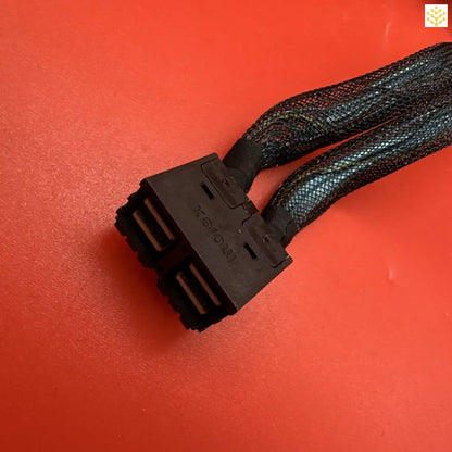 Black SATA power cable connector with mesh sleeving.