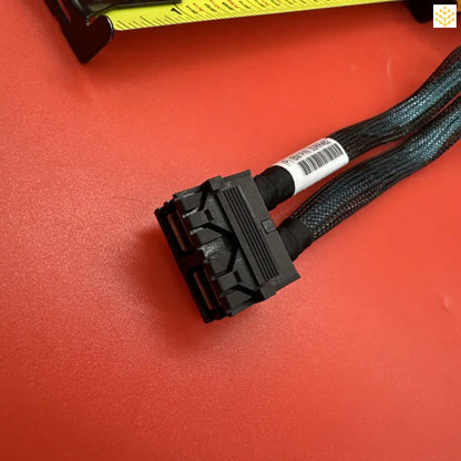 Black SATA power cable connector with braided sleeve.