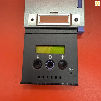 Electronic control panel with an LCD display and three control buttons.