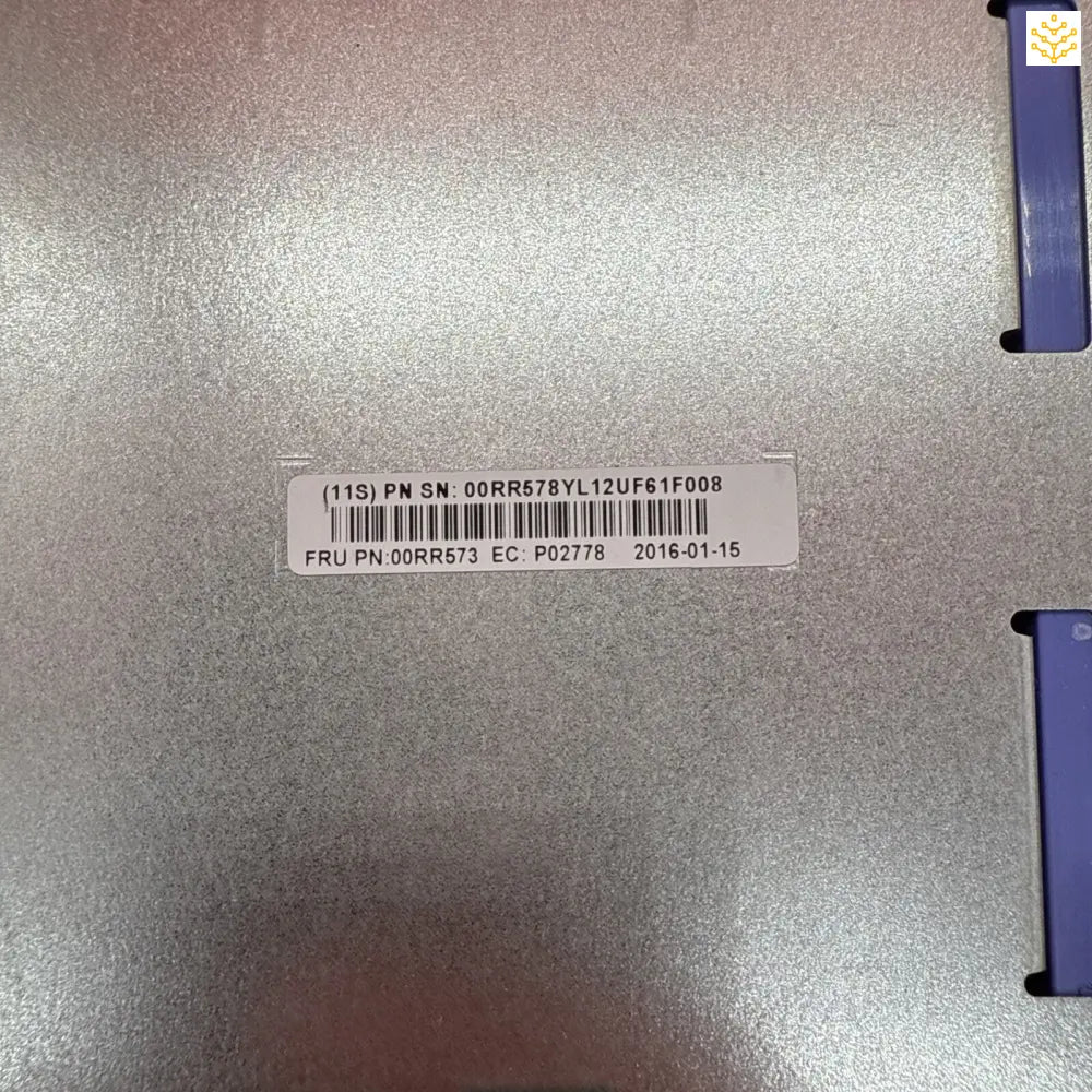 Metallic surface with a printed barcode label and serial number.