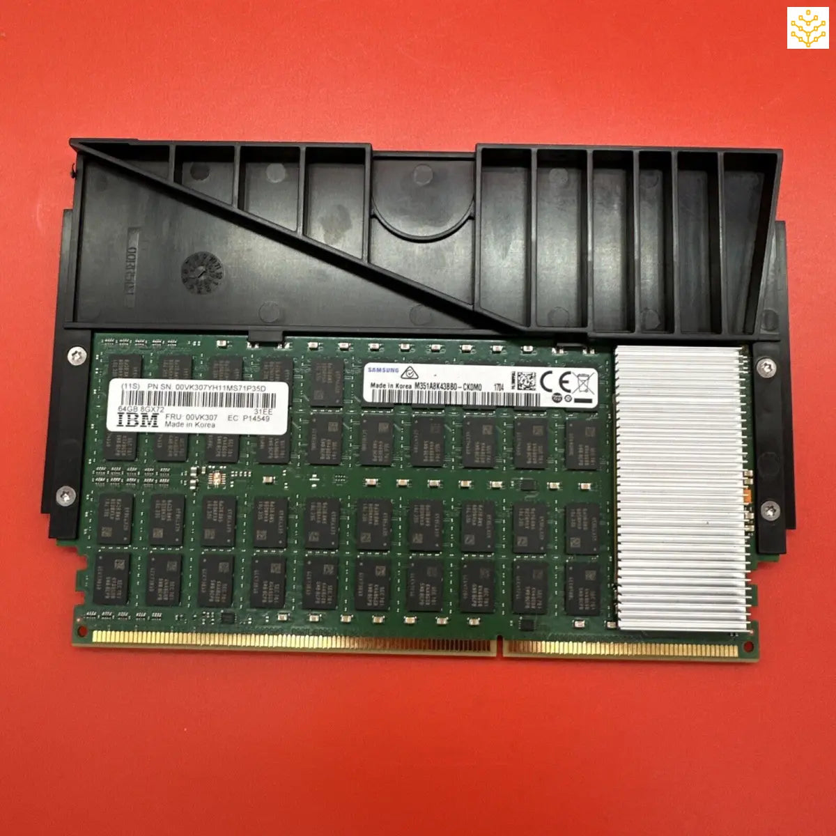 Computer RAM module with a black heatsink attached.