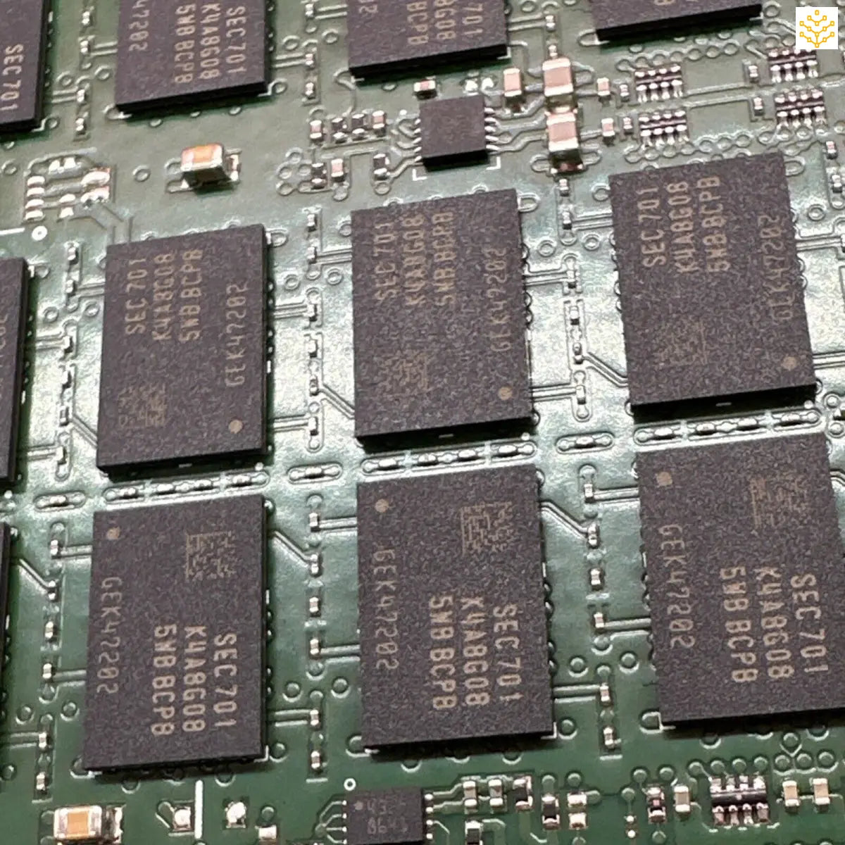 Circuit board with multiple integrated circuit chips mounted on its green surface.