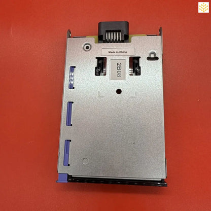 Floppy disk drive mechanism with metal casing and blue plastic components.