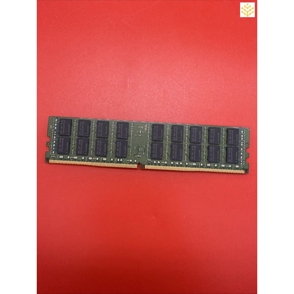 Computer RAM memory stick with black chips mounted on a green circuit board.