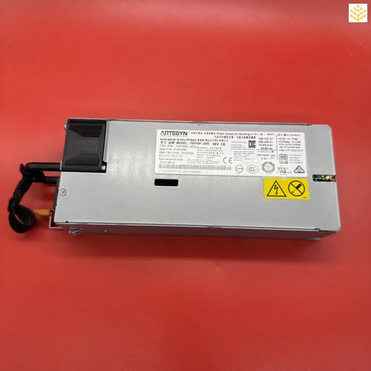 Server power supply unit with warning label and technical specifications.