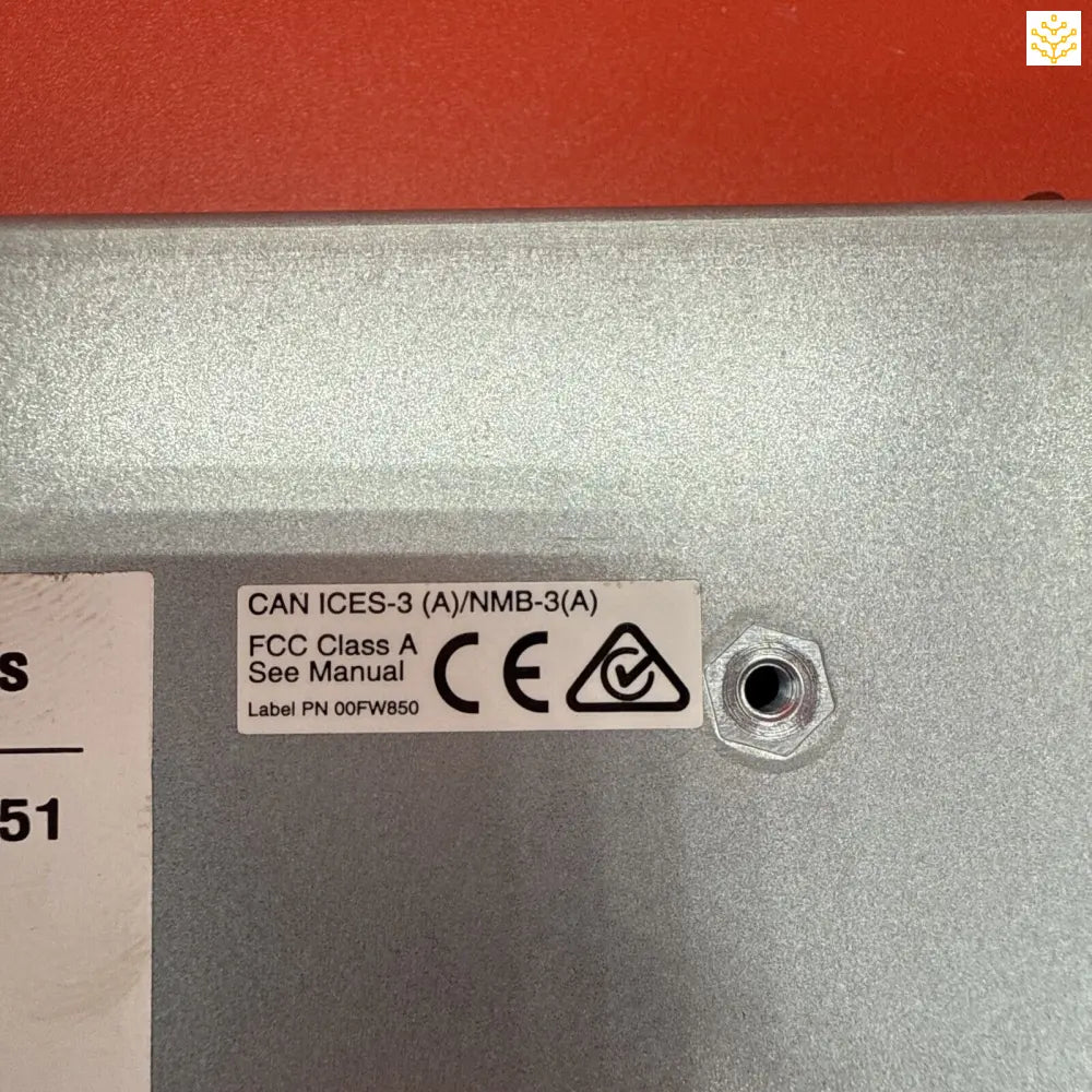 Regulatory certification label on a metallic surface showing FCC Class A and CE markings.