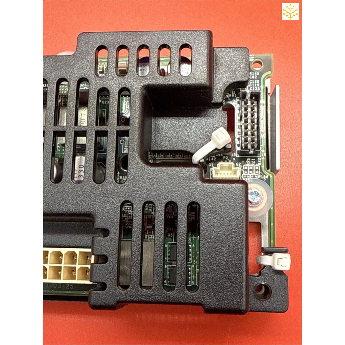 Electronic circuit board component with ventilation slots and connector ports.