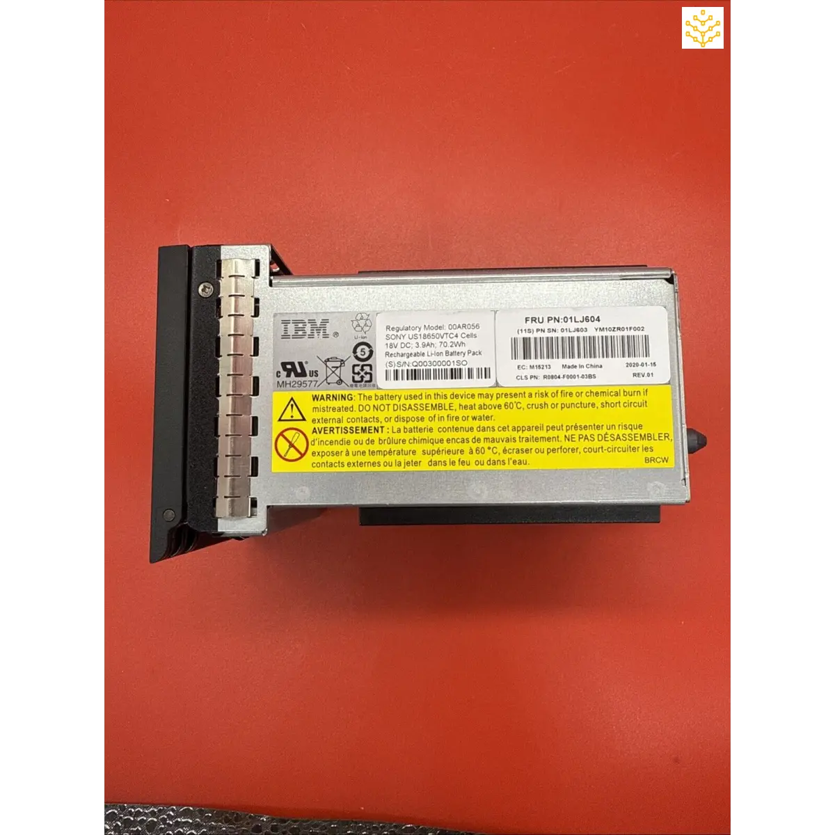 IBM server power supply unit with warning labels and product information.