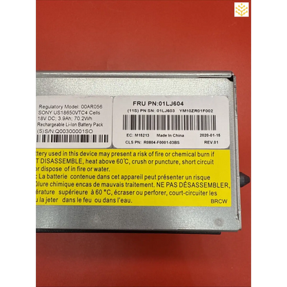 Lithium-ion battery pack with a warning label and product information.