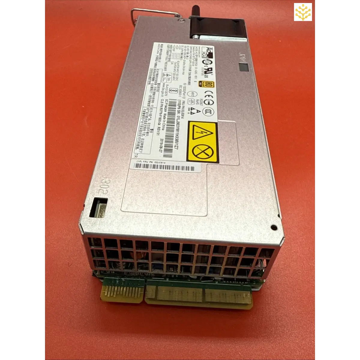 Server power supply unit with visible warning label and ventilation grille.