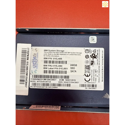 Solid-state drive (SSD) with IBM branding and technical specifications visible on its label.