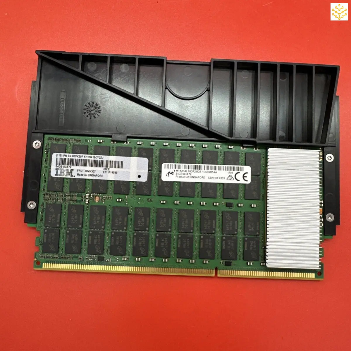 Computer RAM module with a black heatsink attached.