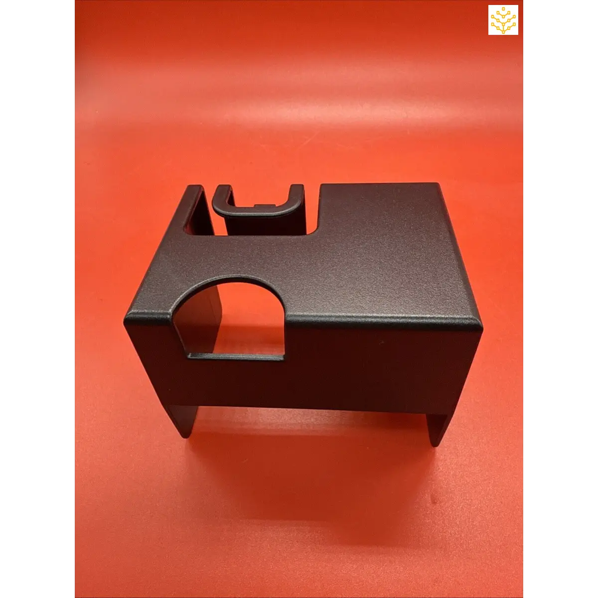 Black plastic mounting bracket with curved cutouts.