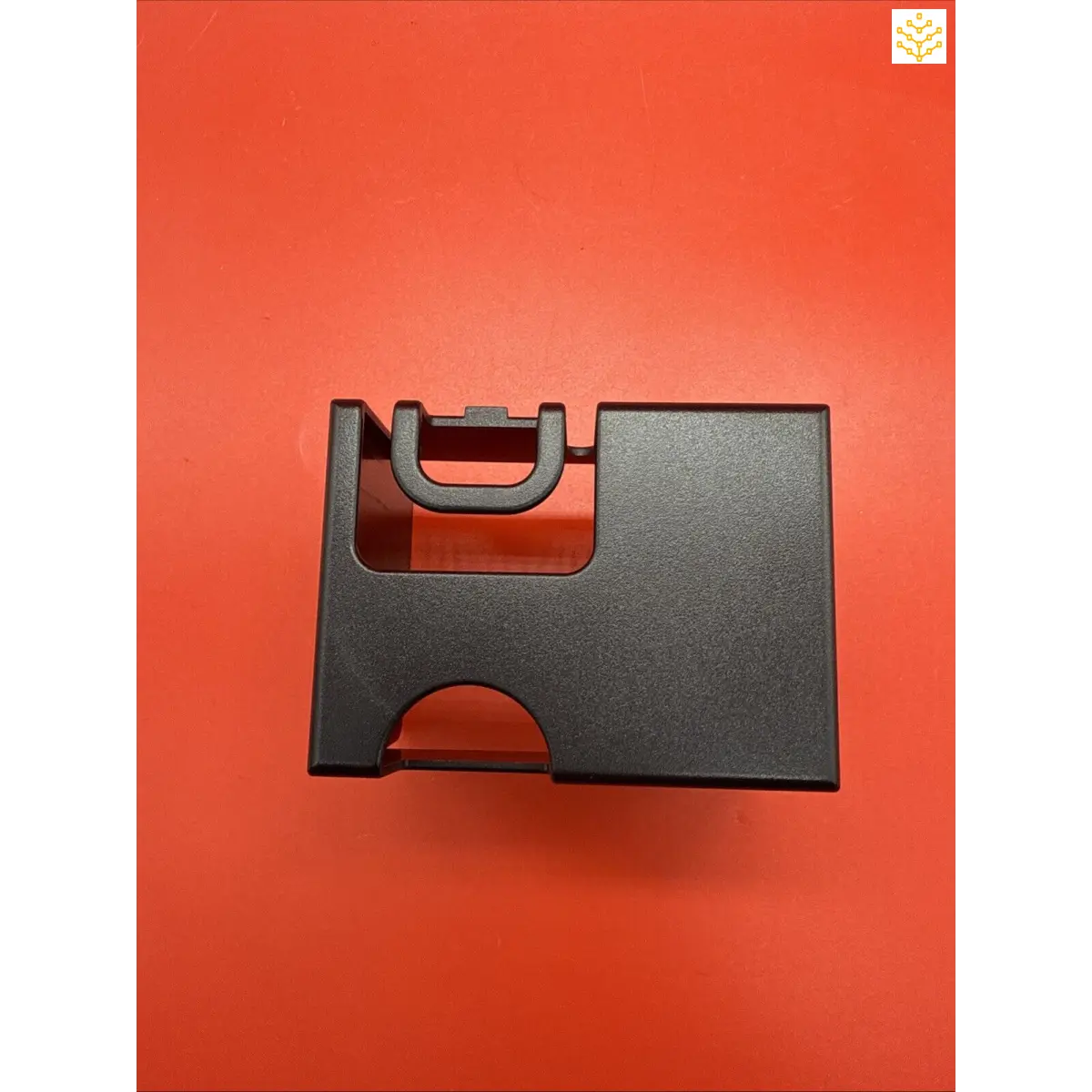 Black plastic card holder with cutout sections.