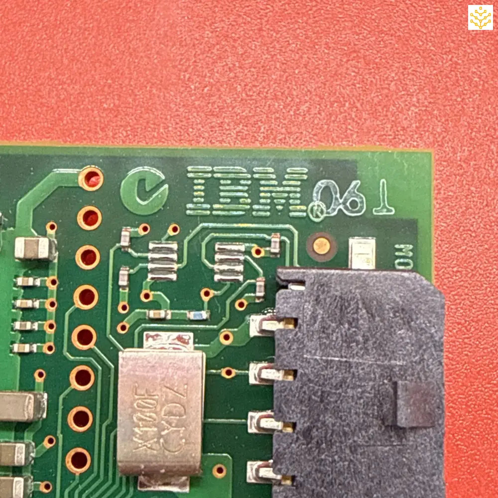 Circuit board with IBM branding and electronic components mounted on a green PCB.