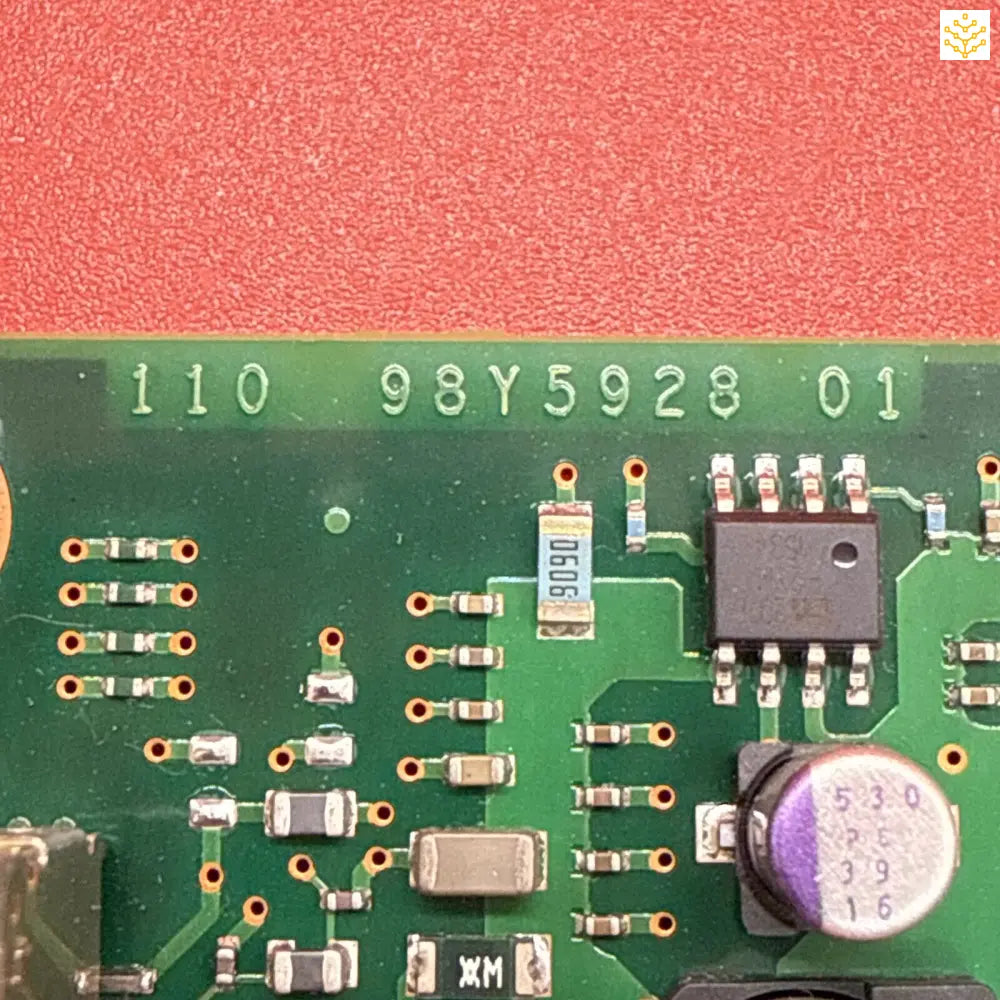 Circuit board with electronic components and a visible serial number.