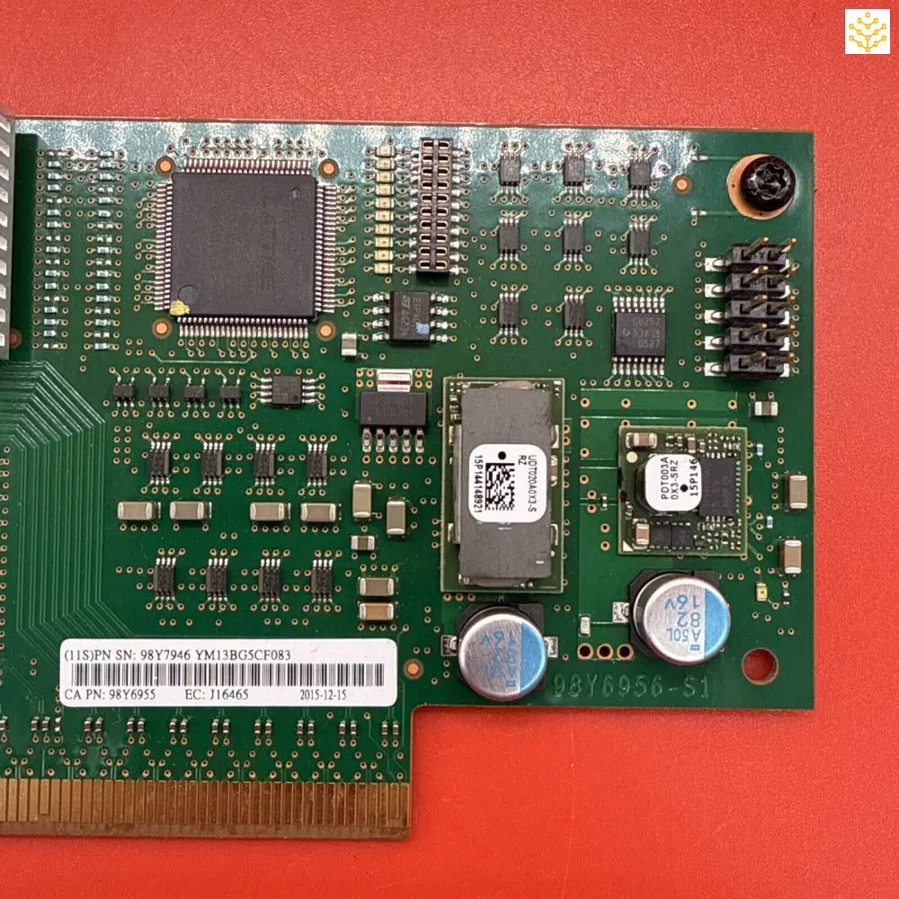 Circuit board with various electronic components including integrated circuits, capacitors, and resistors.