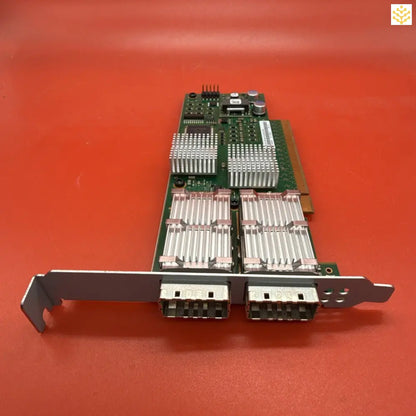 Dual-port network interface card with heat sinks and PCIe connector.