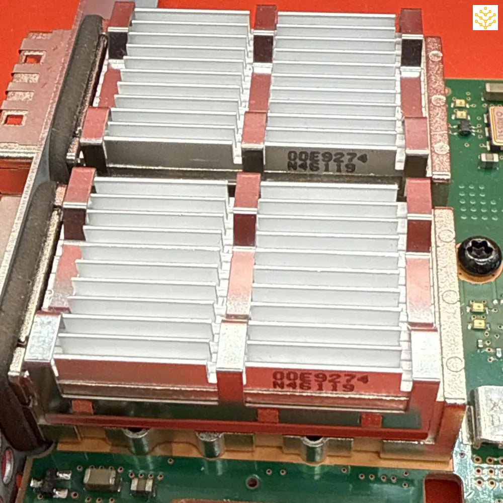 Heat sink with multiple aluminum fins mounted on a circuit board.